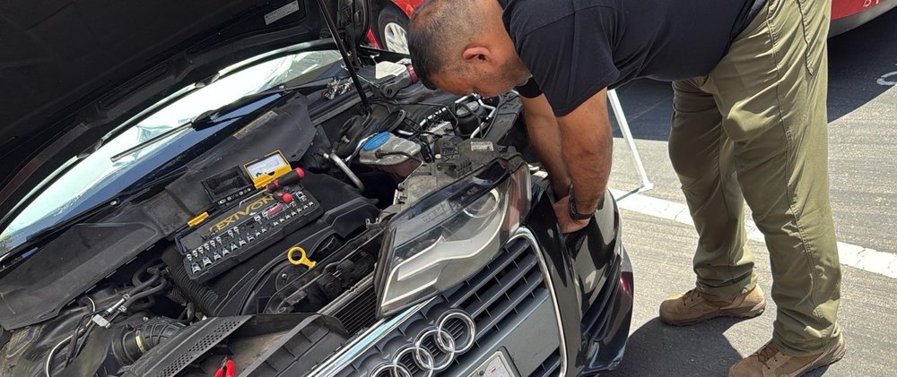 A person working beside an Audi with its hood open, in a photo supplied by Euro Sky HHO.